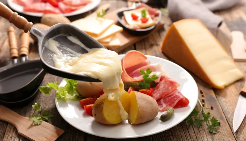 A raclette - melted cheese being scraped over boiled potatoes, cured meat or charcuterie, and cornichons.