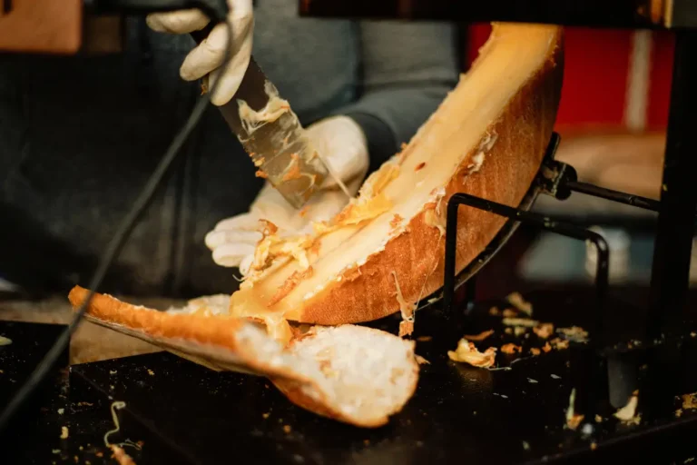 A raclette - melted cheese being scraped over boiled potatoes.