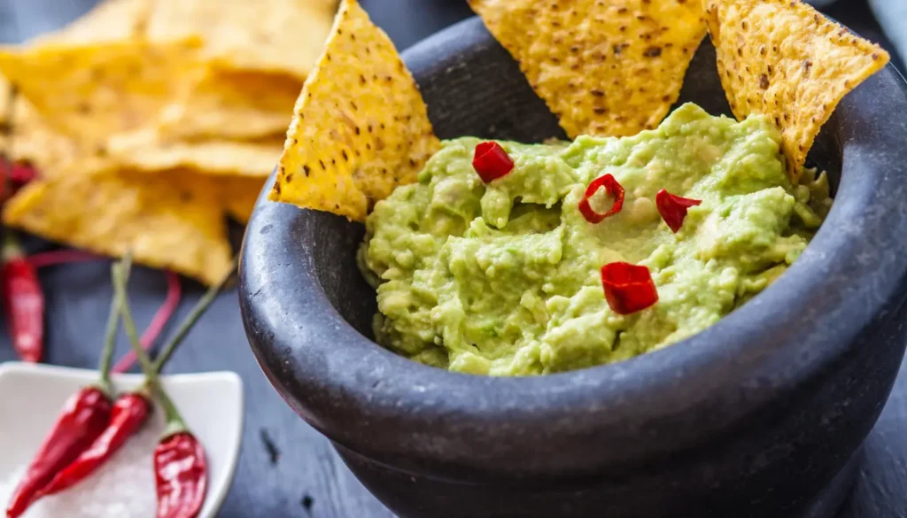 Guacamole in a bowl with tortilla chips