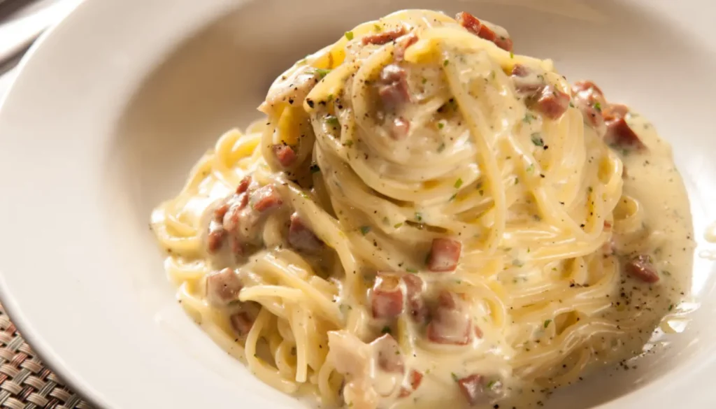 Picture of a plate with carbonara pasta - spaghetti, pancetta and parmiggiano 