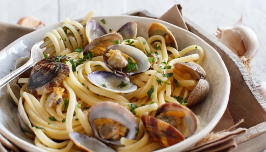 A plate with pasta alla vongole - spaghetti with garlic and clams