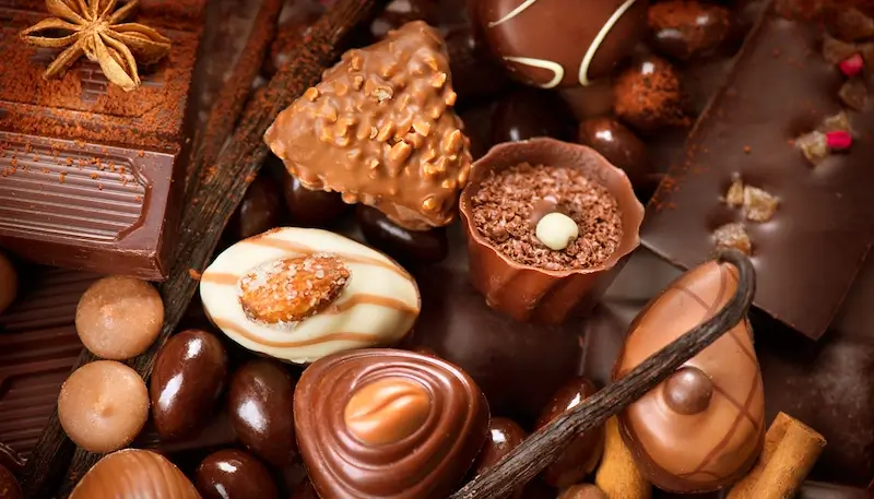 A mix of chocolate pieces with nuts, vanilla, spices, fruits