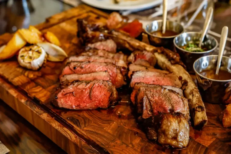 Sliced steak on a wooden board